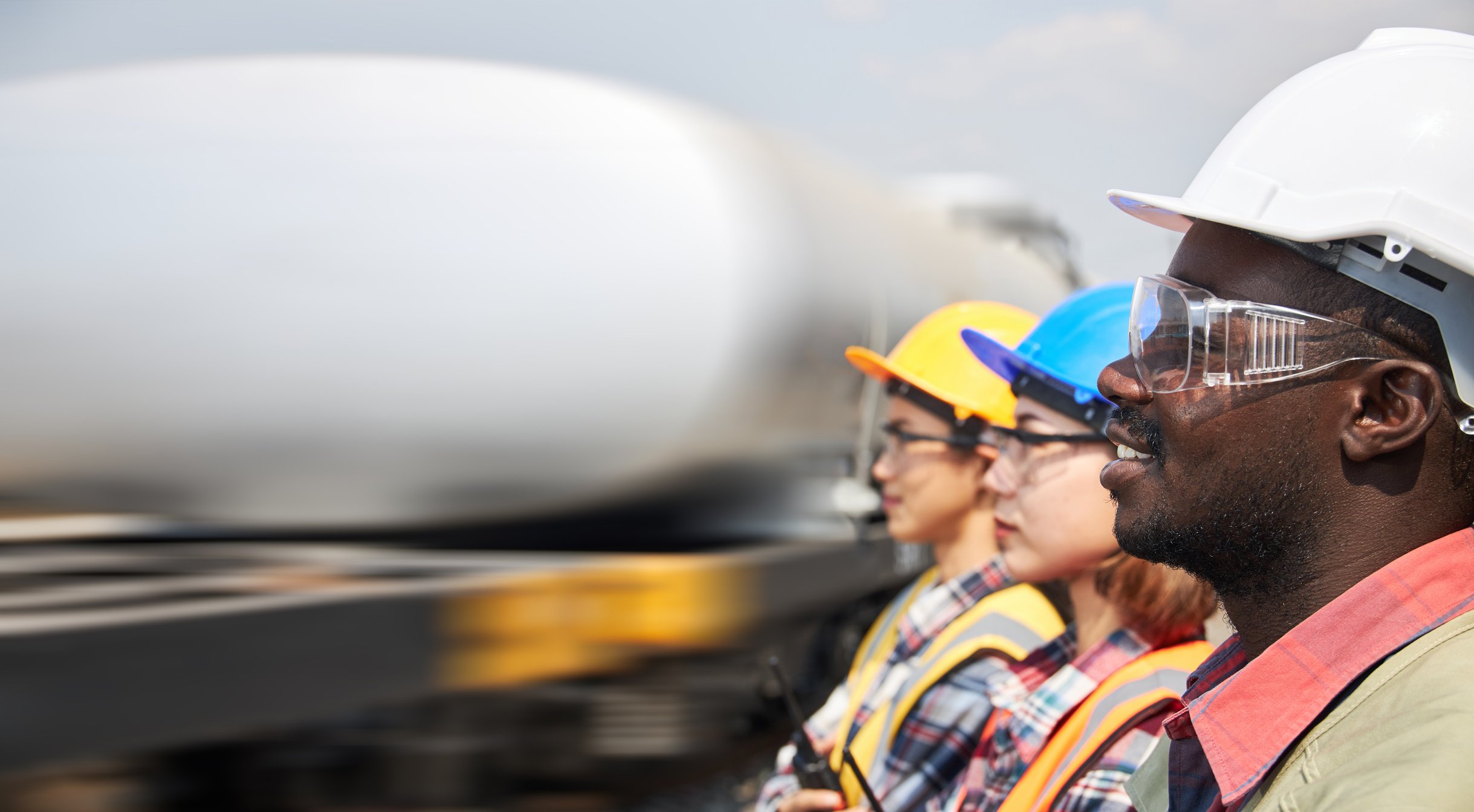 Portrait of a team of petroleum depot engineers.